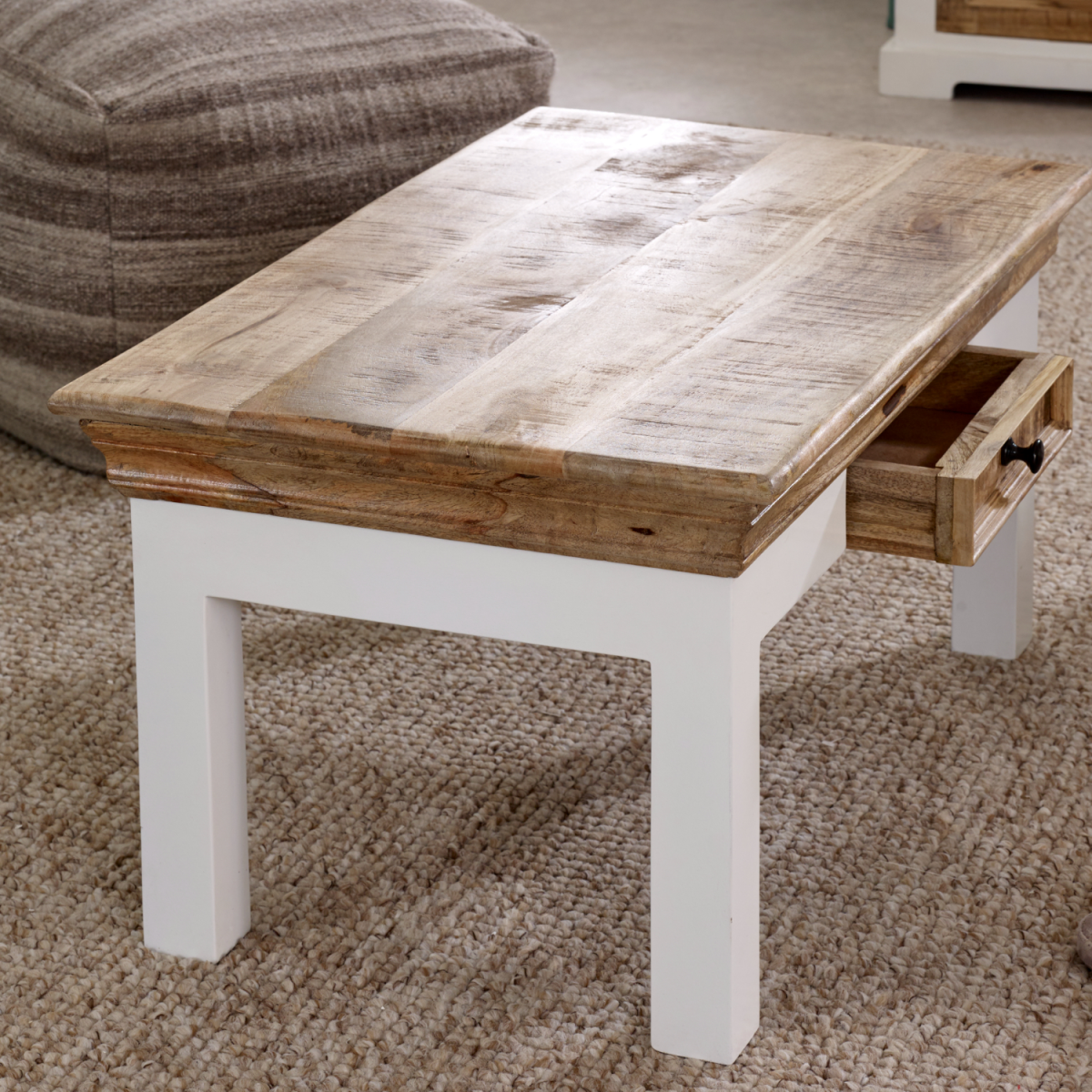 Alfie coffee table with drawer made of solid mango wood, featuring a sleek design for modern living room decor.