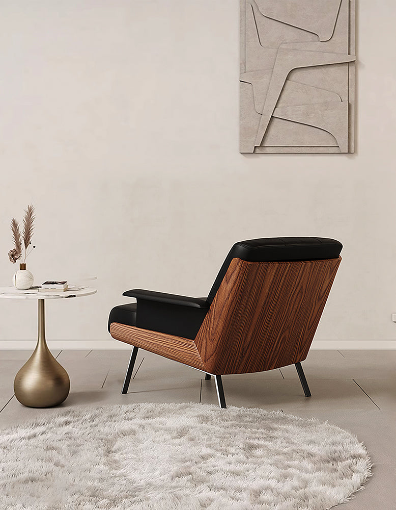 DC Concept Vasilev leather lounge armchair without armrests, modern design with plush cushioning and sleek black leather upholstery.