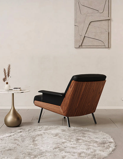 DC Concept Vasilev leather lounge armchair without armrests, modern design with plush cushioning and sleek black leather upholstery.