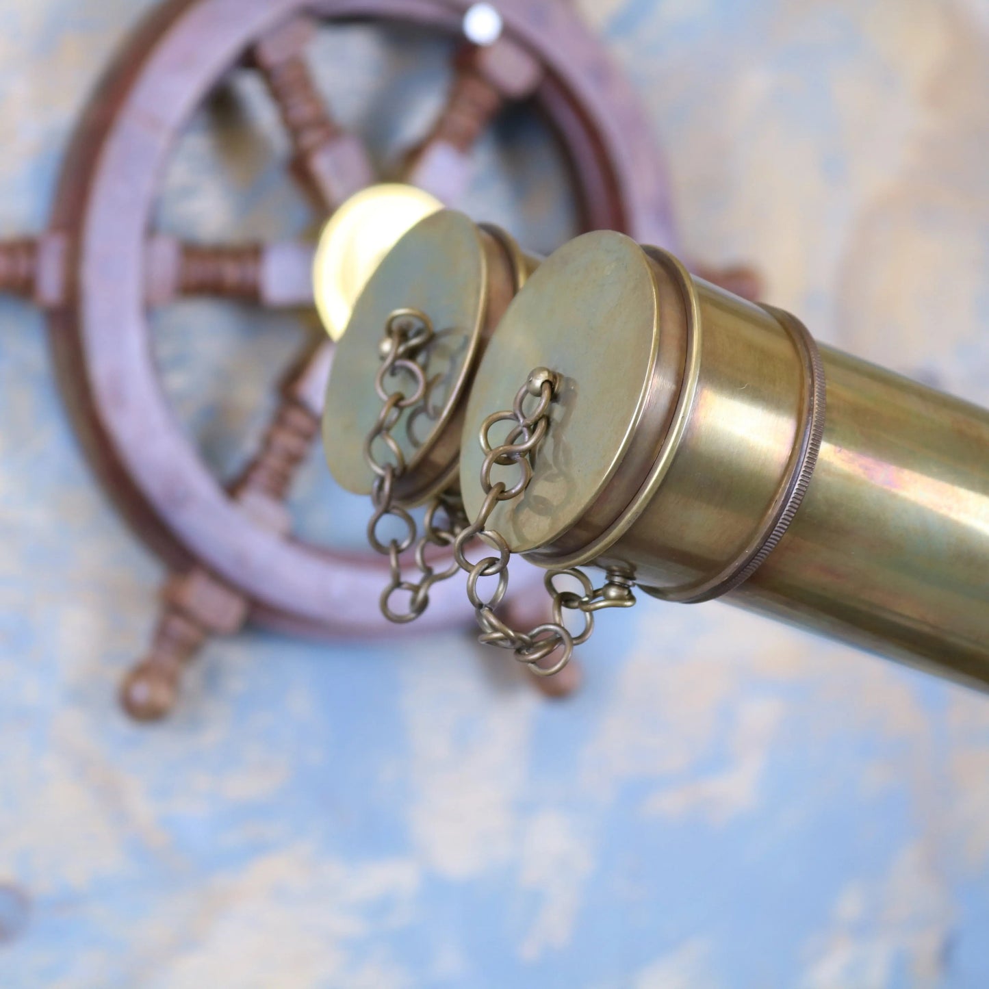 Vintage Maravi Mowai binoculars ornament mounted on a tripod, decorative antique-style piece for display or collection.