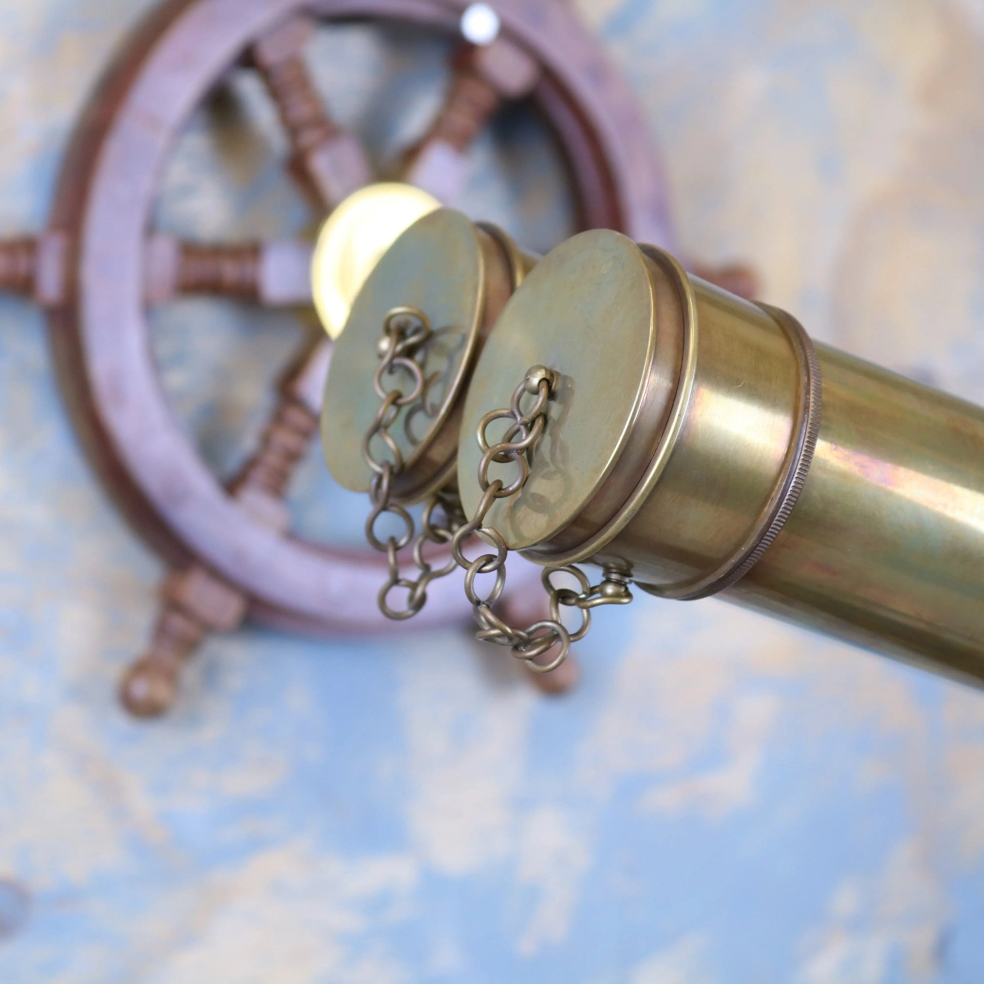Vintage Maravi Mowai binoculars ornament mounted on a tripod, decorative antique-style piece for display or collection.
