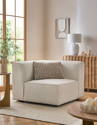 DC Concept Van Dyke Modular Sofa, three-seater corner sofa with plush cushions and modern design in a living room setting.