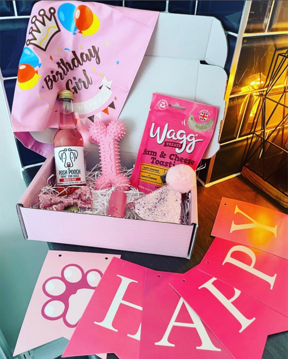 Birthday Girl dog hamper by The Bonnie Hound with treats, toys, and festive accessories for celebrating dogs.