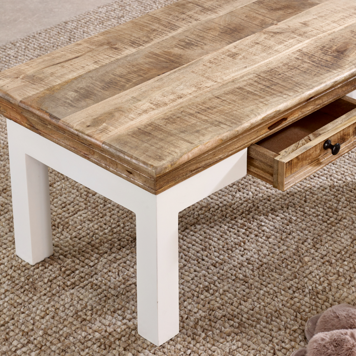 Alfie coffee table with drawer made of solid mango wood, featuring a modern design and natural wood finish for home and kitchen decor.
