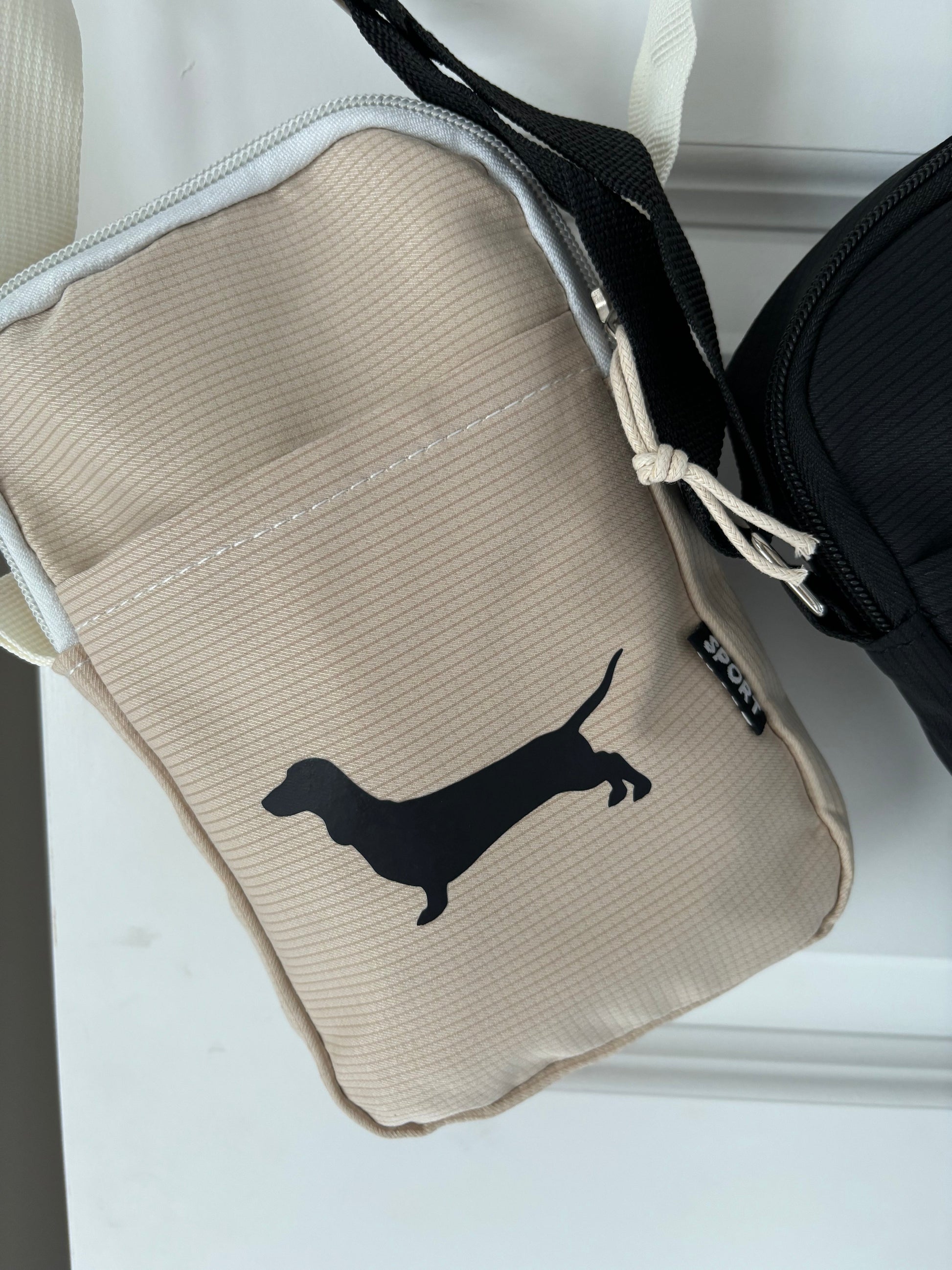 Dachshund sausage dog cross body bag with matching pouch and zipper, stylish accessory by The Bonnie Hound, featuring playful dog design.