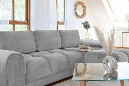 Azzuro universal corner sofa bed in plush grey velvet with convertible design and built-in storage, shown in a modern living room setting.