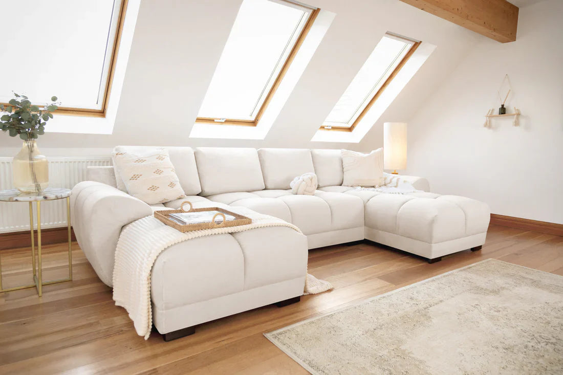 A cream Azzuro plush velvet U-shape corner sofa with anti-slip feet, showcasing soft cushions and modern design.