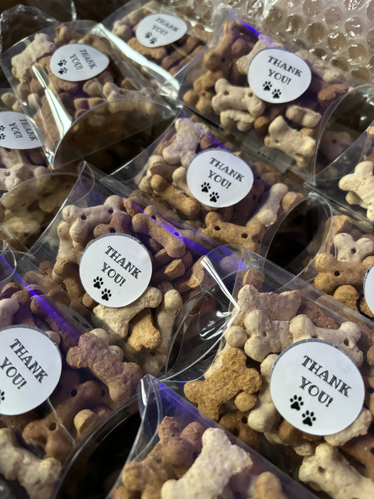 Assorted dog chocolate and biscuit treats in a pick and mix thank you box from The Bonnie Hound, featuring colorful treats and packaging.