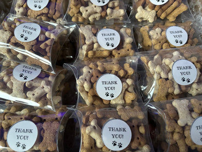 Assorted dog chocolate and biscuit treats in thank you pick n mix boxes from The Bonnie Hound, displayed in a colorful arrangement.