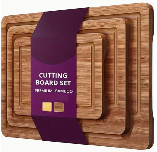 Set of eco-friendly bamboo cutting boards for meat and vegetables, featuring natural wooden surface and durable design by DEPOT.