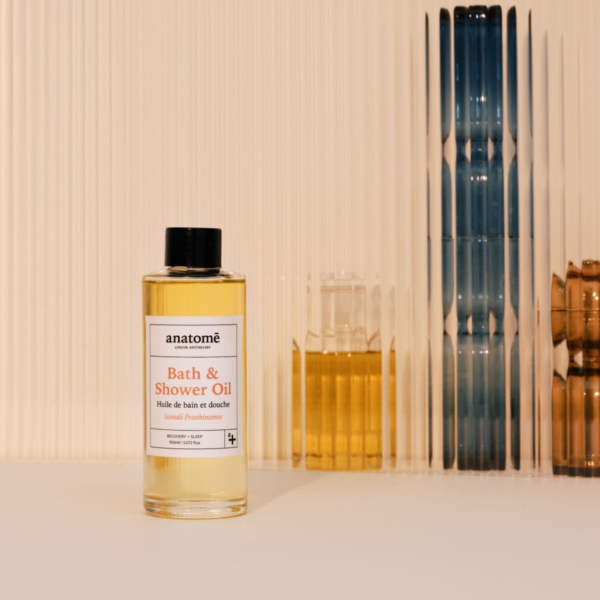 Anatomē Somali Frankincense Bath and Shower Oil bottle with elegant packaging and label, designed for nourishing skin.
