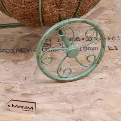 Vintage green metal bike garden planter by Maravi, featuring a charming garden decor design with visible plant holders and rustic finish.