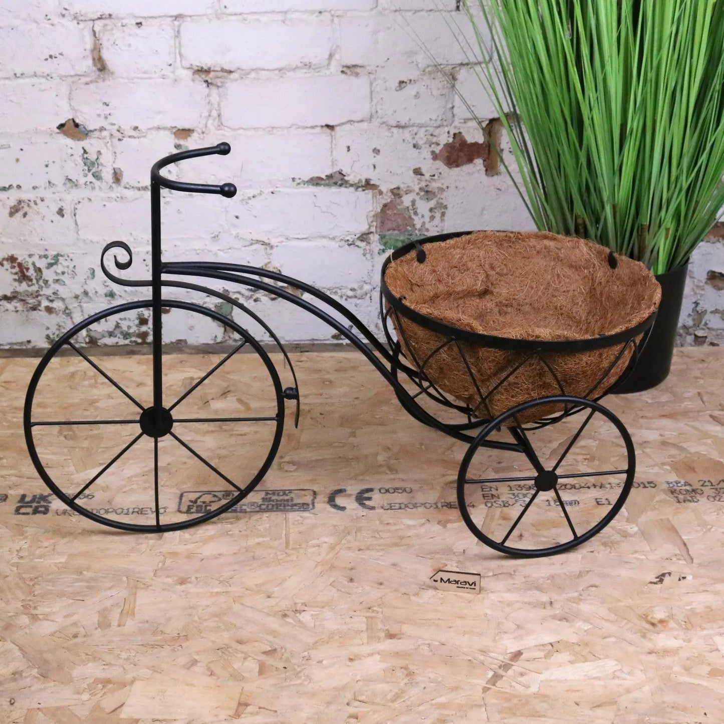 Vintage black metal bike garden planter by Maravi, featuring a rustic design suitable for outdoor garden decor.