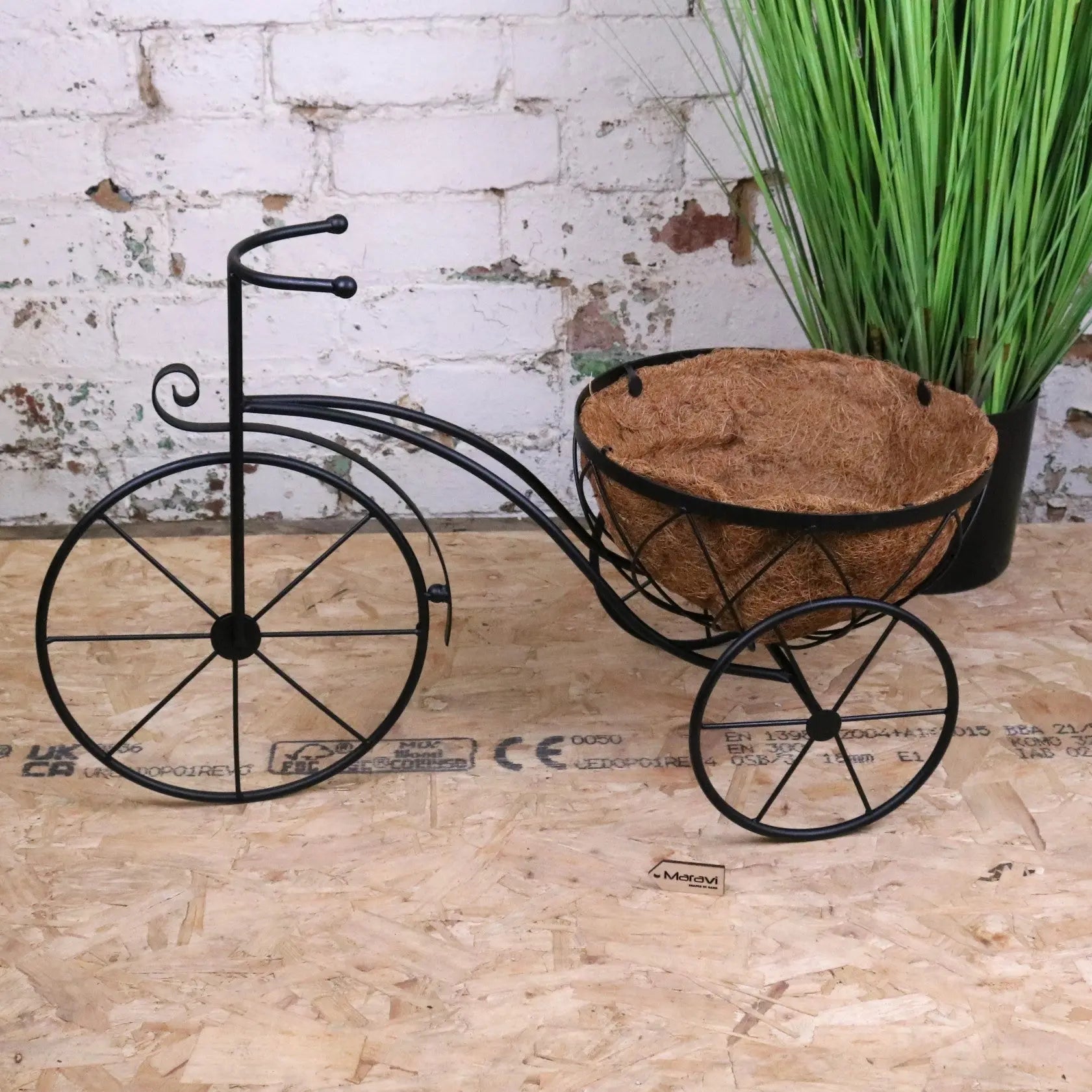 Vintage black metal bike garden planter by Maravi, featuring a rustic design suitable for outdoor garden decor.