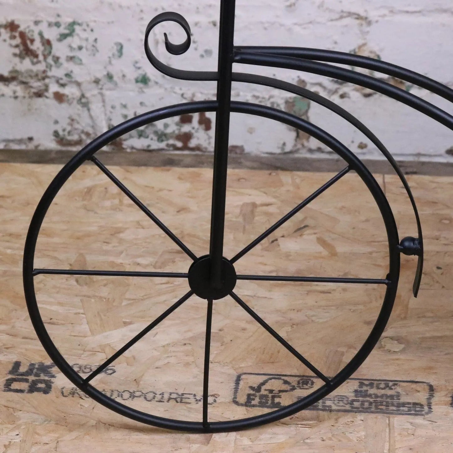Vintage black metal bike garden planter by Maravi, featuring a classic bike design suitable for outdoor garden decor.
