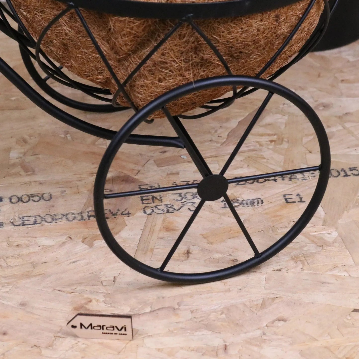 Vintage black metal bike garden planter by Maravi featuring a rustic, decorative bike design perfect for outdoor garden decor.