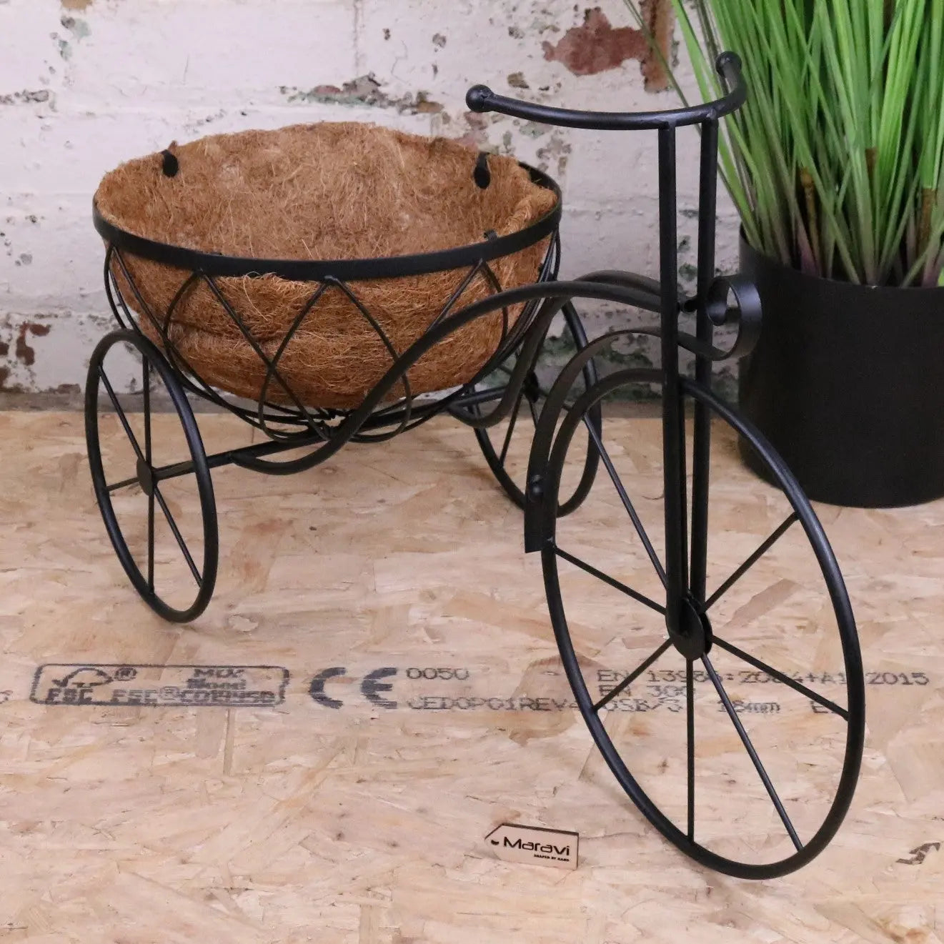 Black vintage metal bike garden planter with a rustic design, perfect for outdoor garden décor by Maravi.