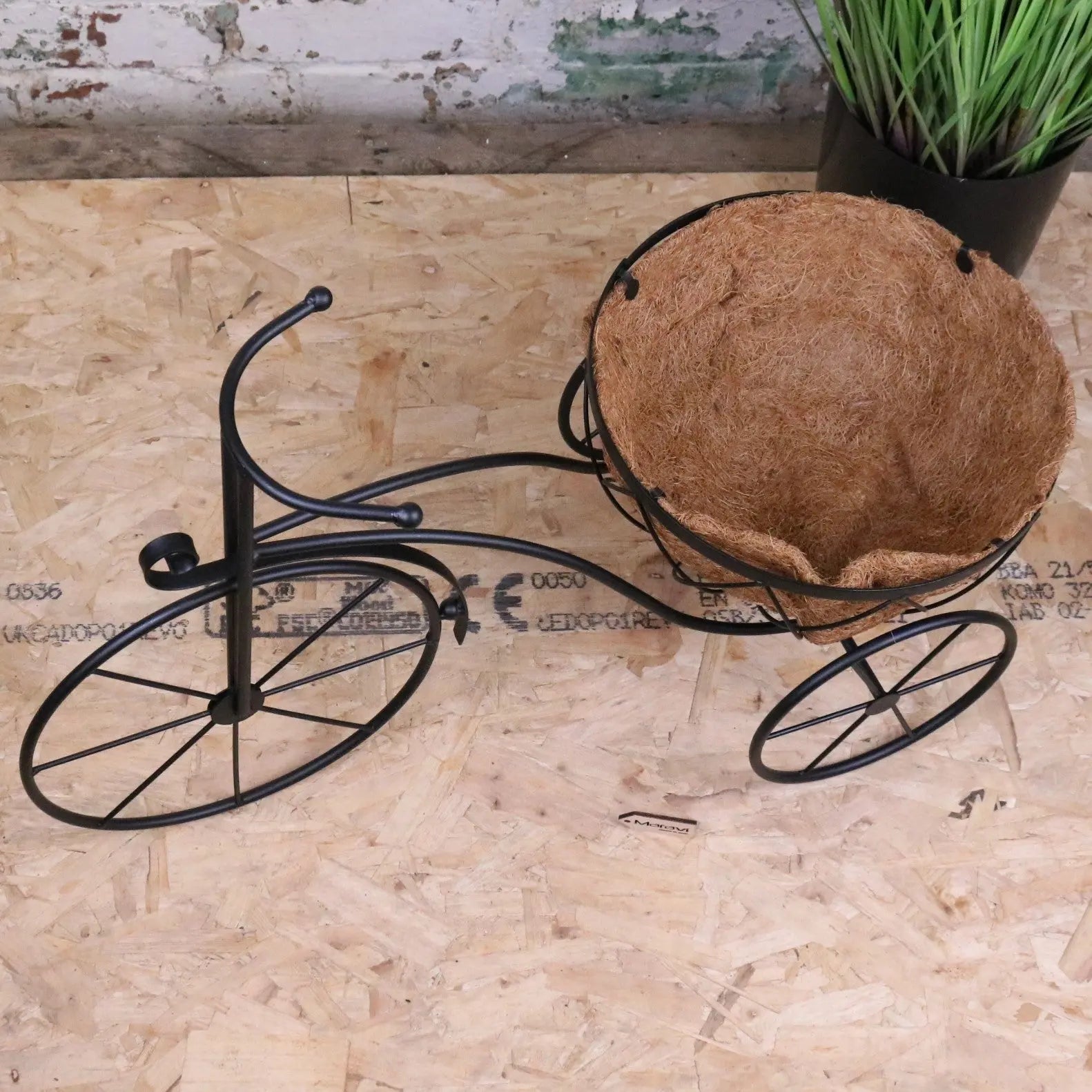 Black vintage metal bike garden planter by Maravi, featuring a charming retro design for outdoor garden decoration.