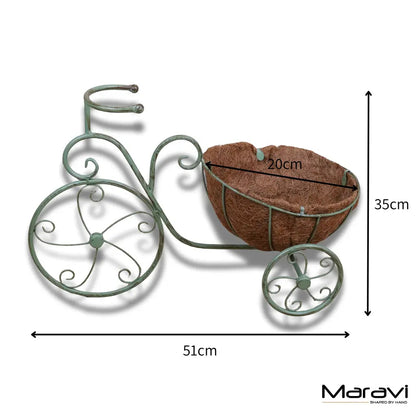 Vintage green metal bike garden planter by Maravi, featuring a charming garden decor design.