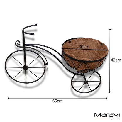 Black vintage metal bike garden planter by Maravi with a rustic, decorative design for outdoor gardening.