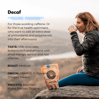 Organic decaf coffee by Exhale Healthy Coffee in a bag, with a steaming cup of brewed decaf coffee next to it.