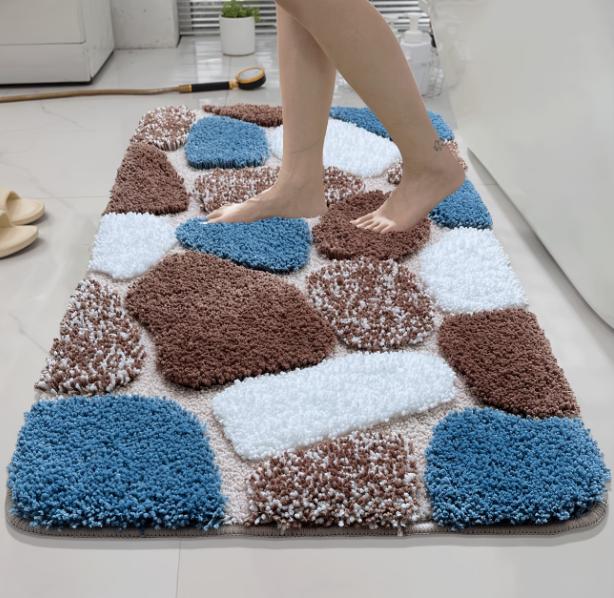 Colorful checkered pebble-style plush bath mat with non-slip rubber backing, soft and machine washable bathroom rug by DEPOT.