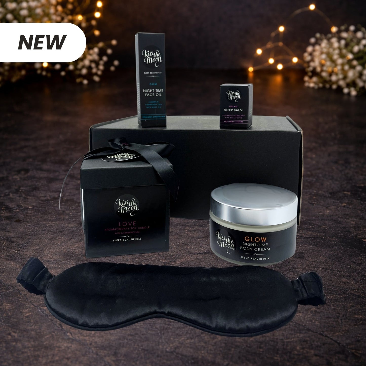 Kiss the Moon Discovery Bundle with skincare products, including bottles and jars arranged on a white background.