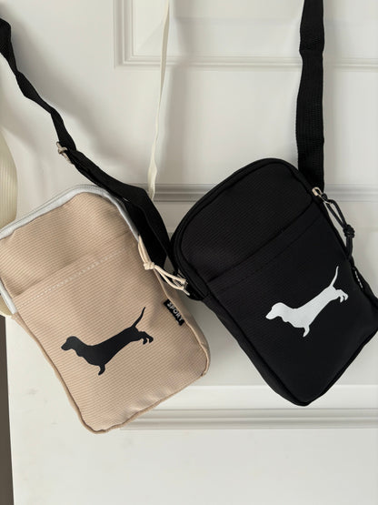 Dachshund sausage dog cross body bag with pouch and zipper, featuring detailed dog-shaped design and adjustable strap.