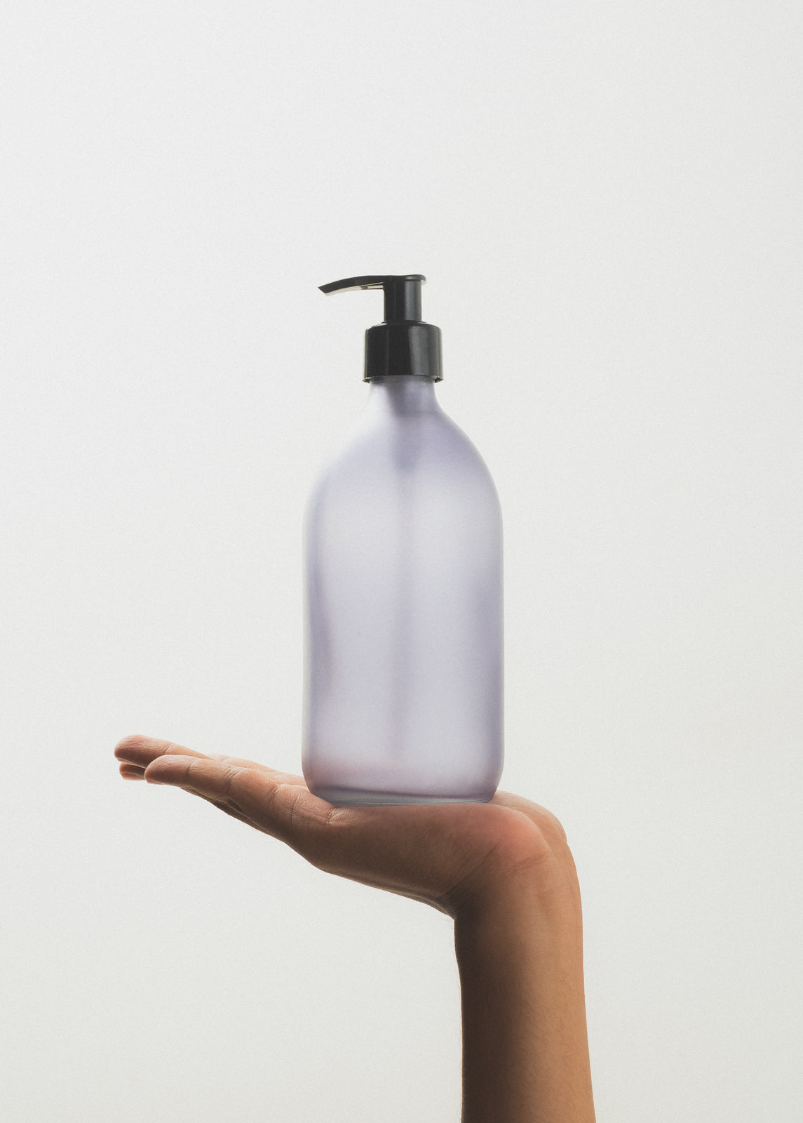 Grey matte soap pump dispenser with black plastic pump, designed for easy use and stylish bathroom or kitchen decor.