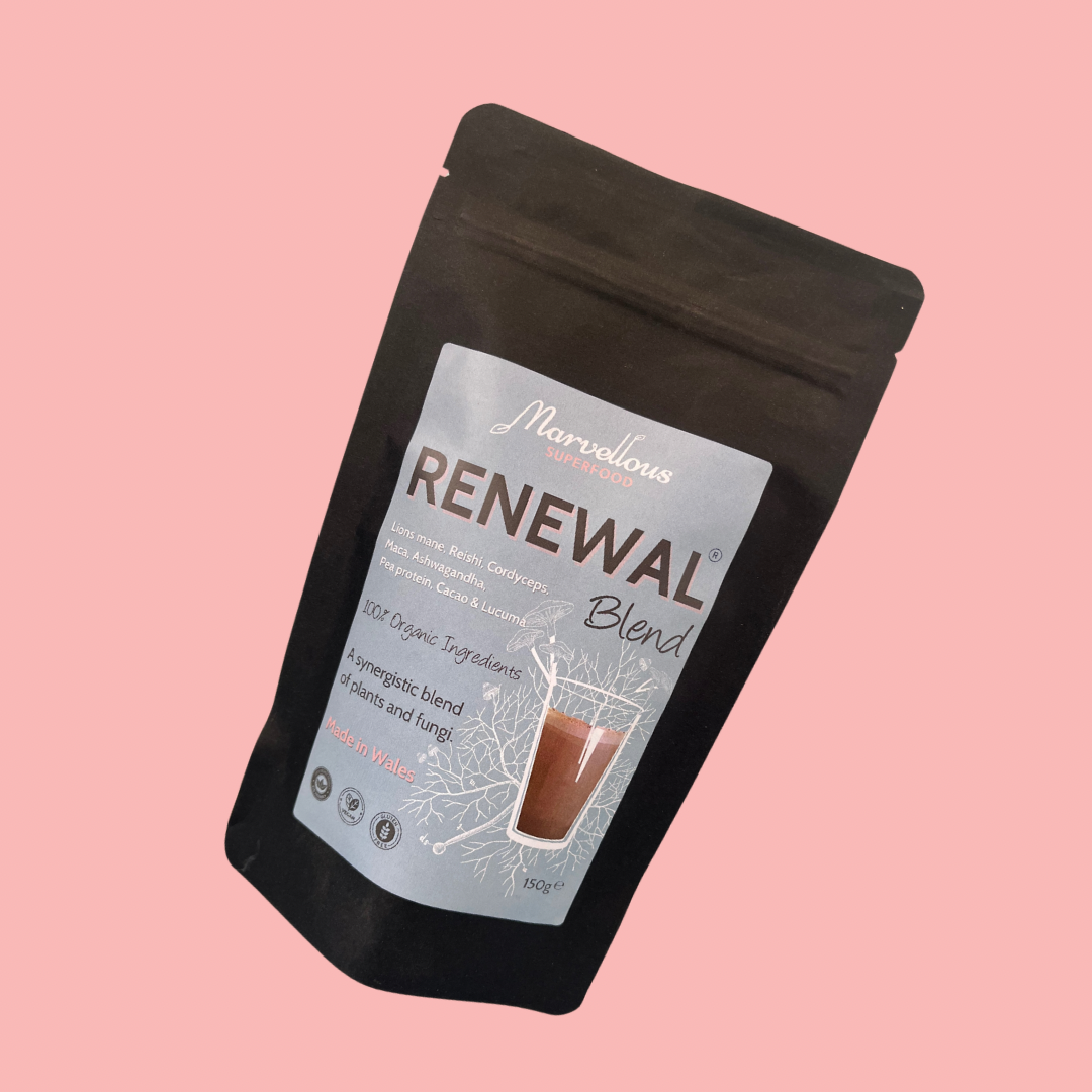 MarvellousSuperfood Renewal Blend superfoods and protein powder in a clear container with a scoop for healthy nutrition.