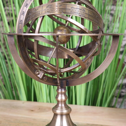 Large brass armillary sphere ornament by Maravi, 30cm desk accessory with intricate rings and celestial design.