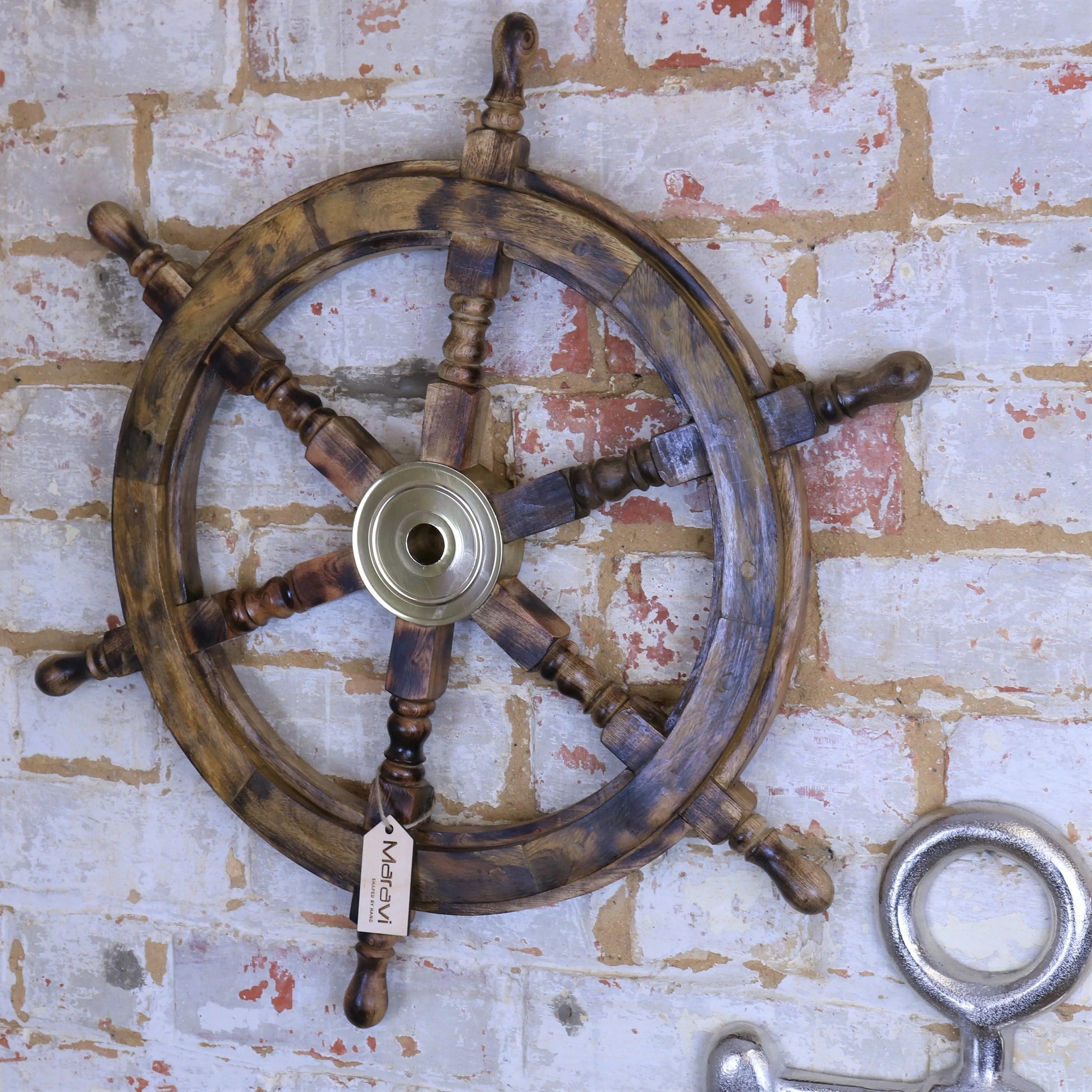 Naav wooden ships wheel ornament in natural wood finish, decorative maritime decor by Maravi, visible with detailed wood grain.