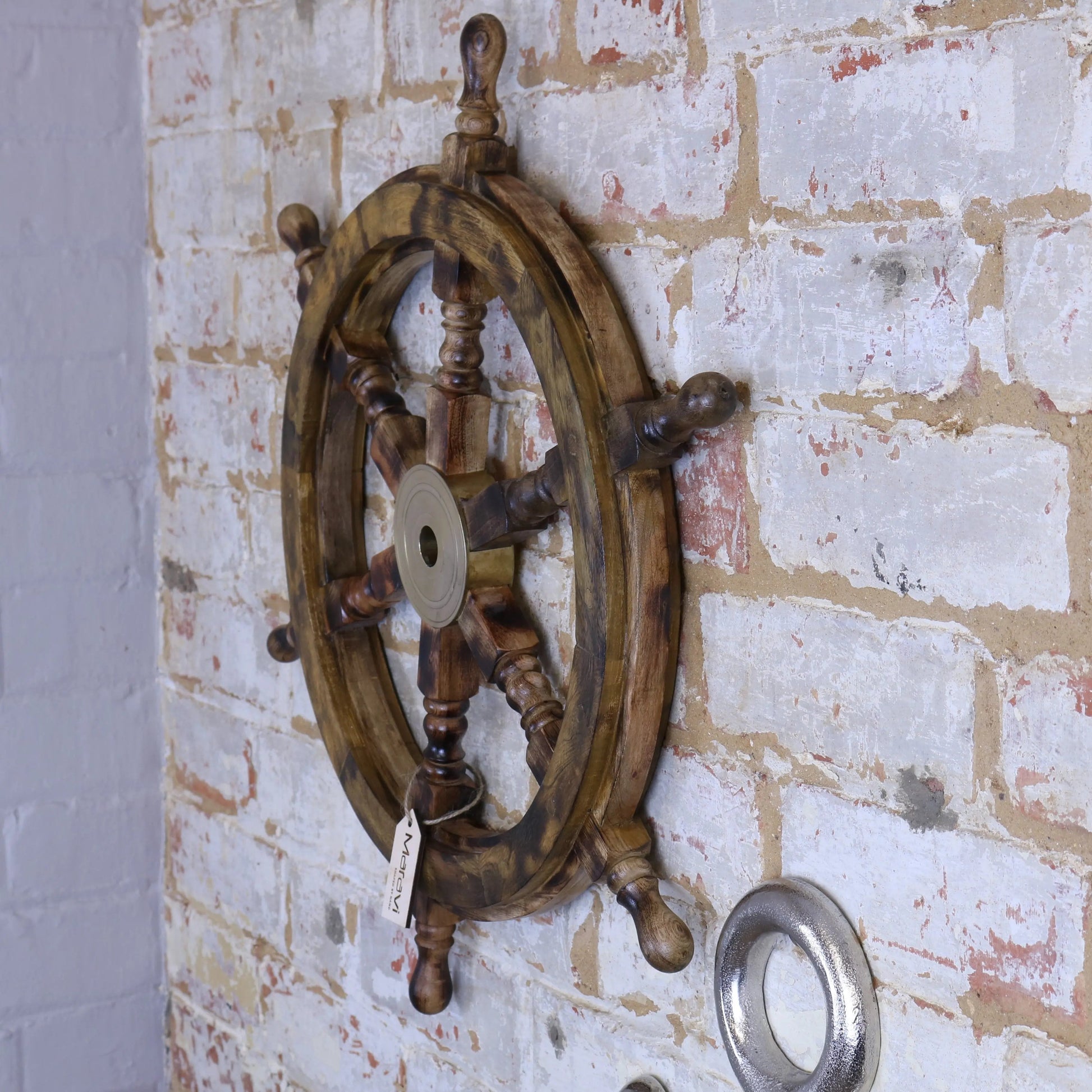 Naav wooden ships wheel ornament in natural wood finish, decorative maritime decor by Maravi, showing detailed craftsmanship.