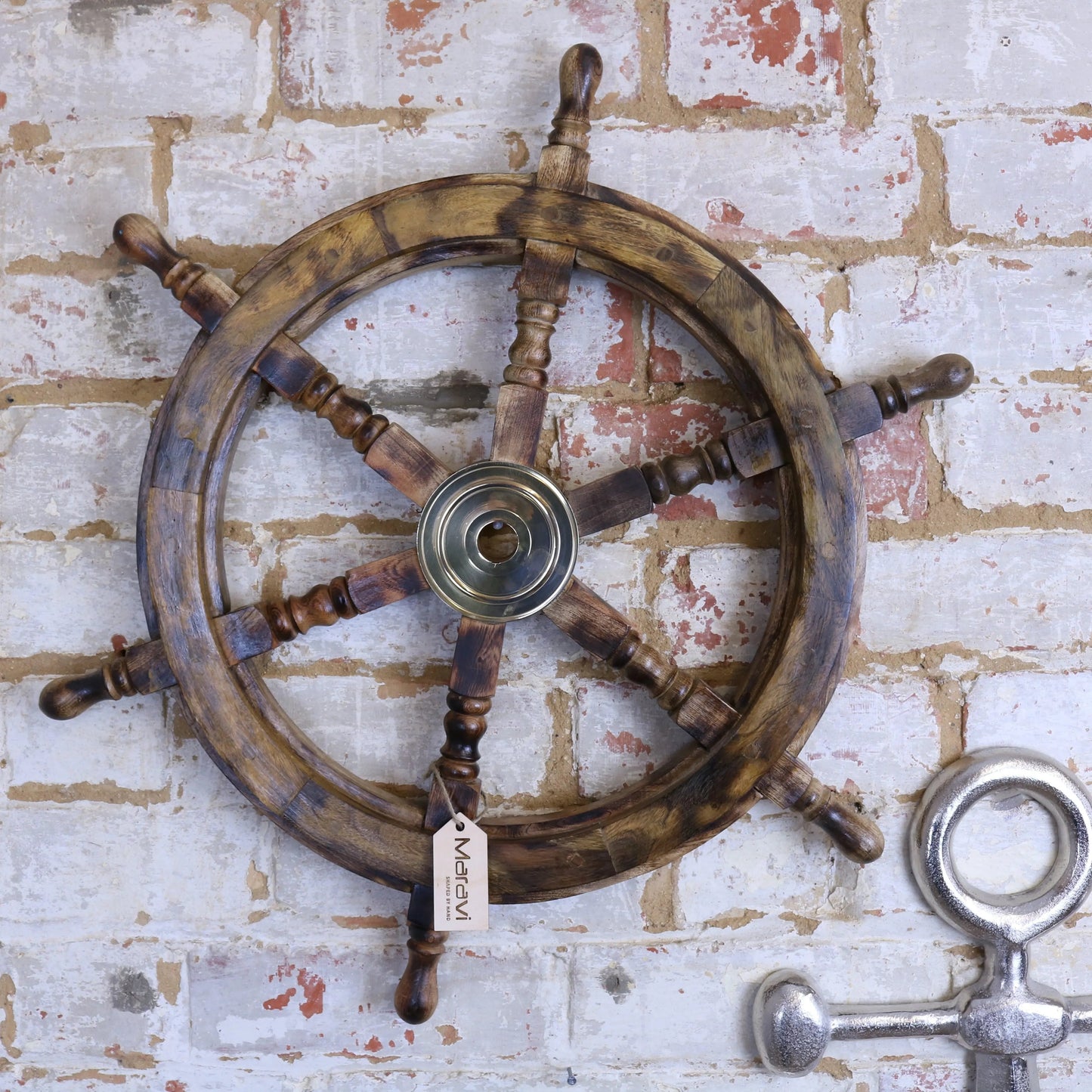Naav wooden ships wheel ornament in natural color by Maravi, showcasing detailed craftsmanship and nautical design.