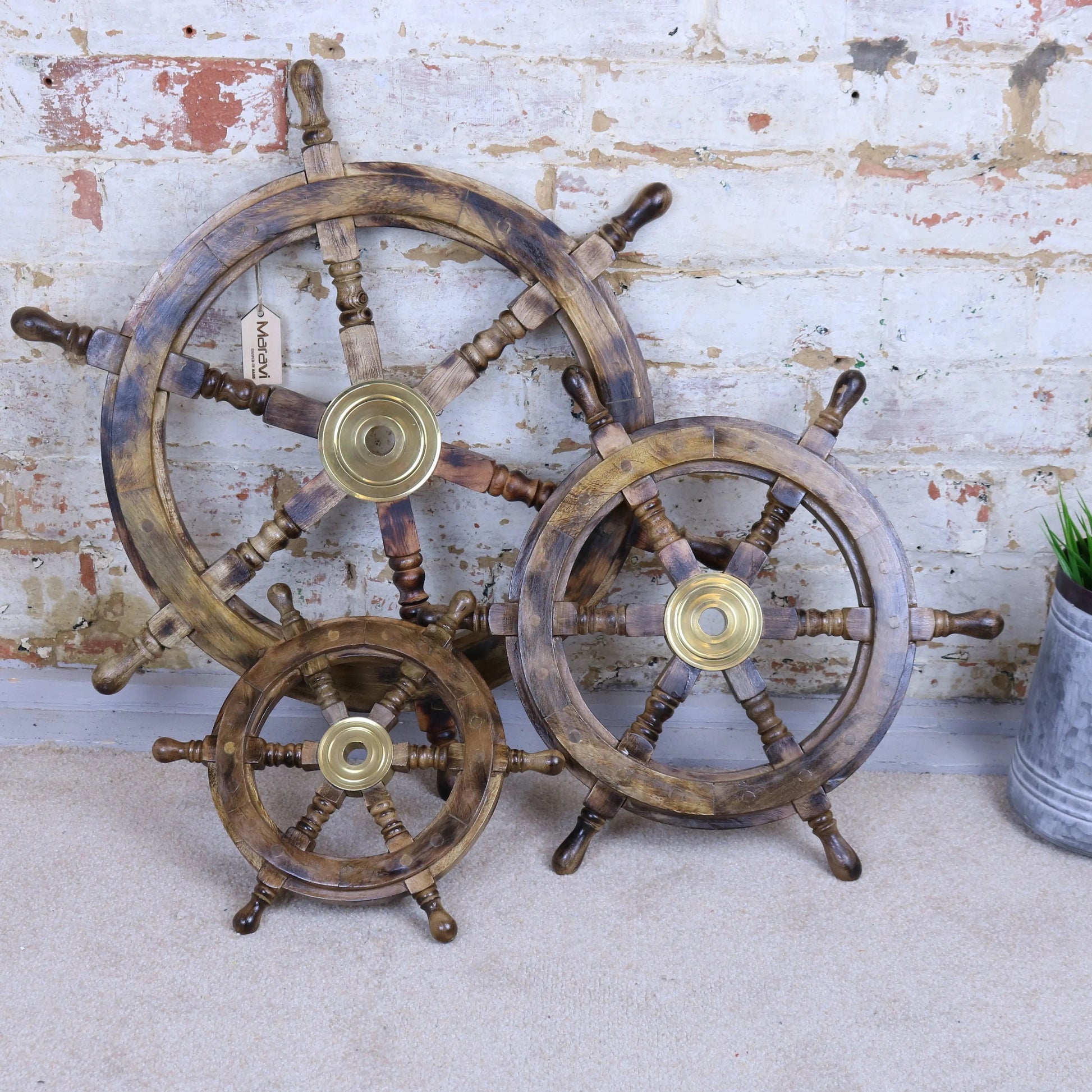 Naav wooden ships wheel ornament in natural wood finish, decorative maritime decor by Maravi, showing detailed craftsmanship.