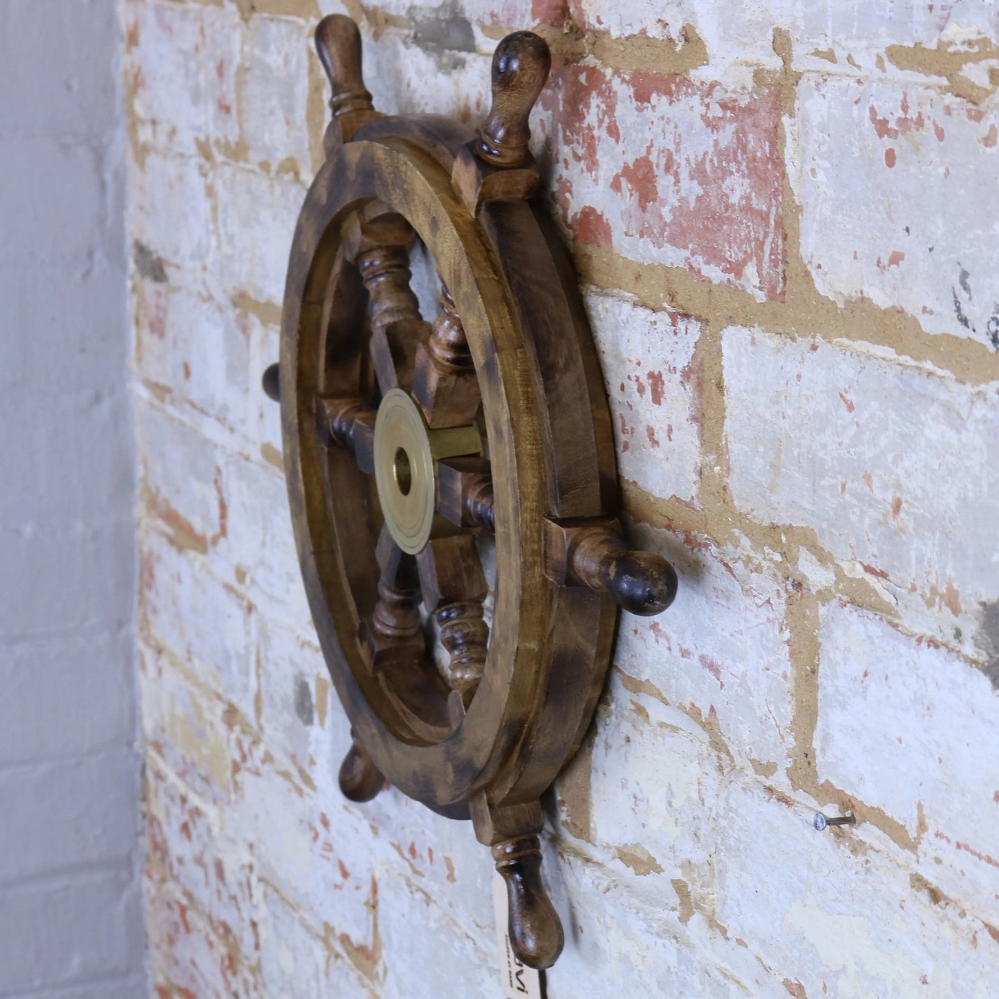 Naav wooden ships wheel ornament in natural wood finish, decorative maritime decor by Maravi, detailed craftsmanship visible.