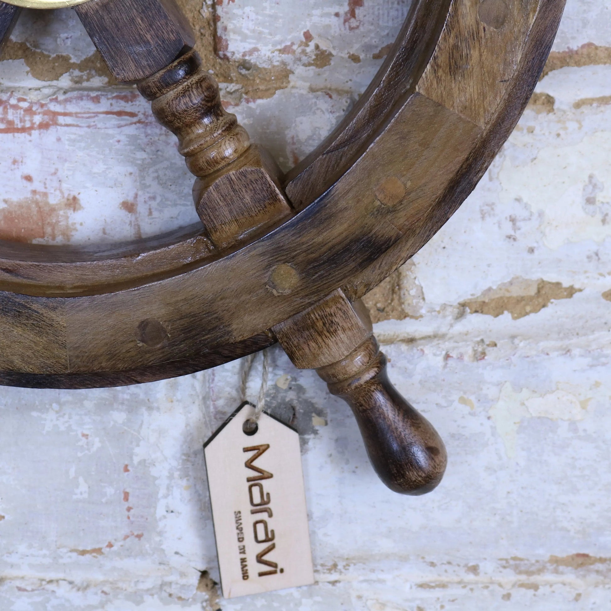 Naav wooden ships wheel ornament in natural wood finish, crafted by Maravi, displayed as a decorative nautical ornament.
