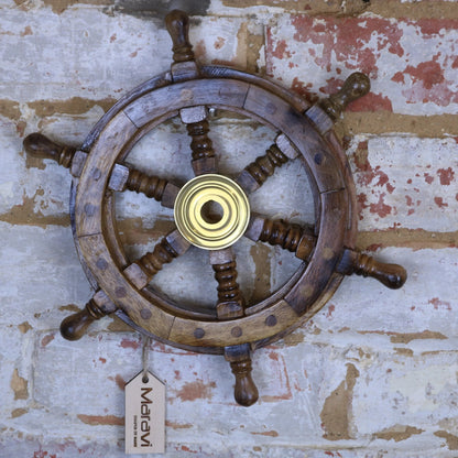 Maravi Naav wooden ships wheel ornament in natural wood finish, detailed nautical decor for maritime-themed interiors.