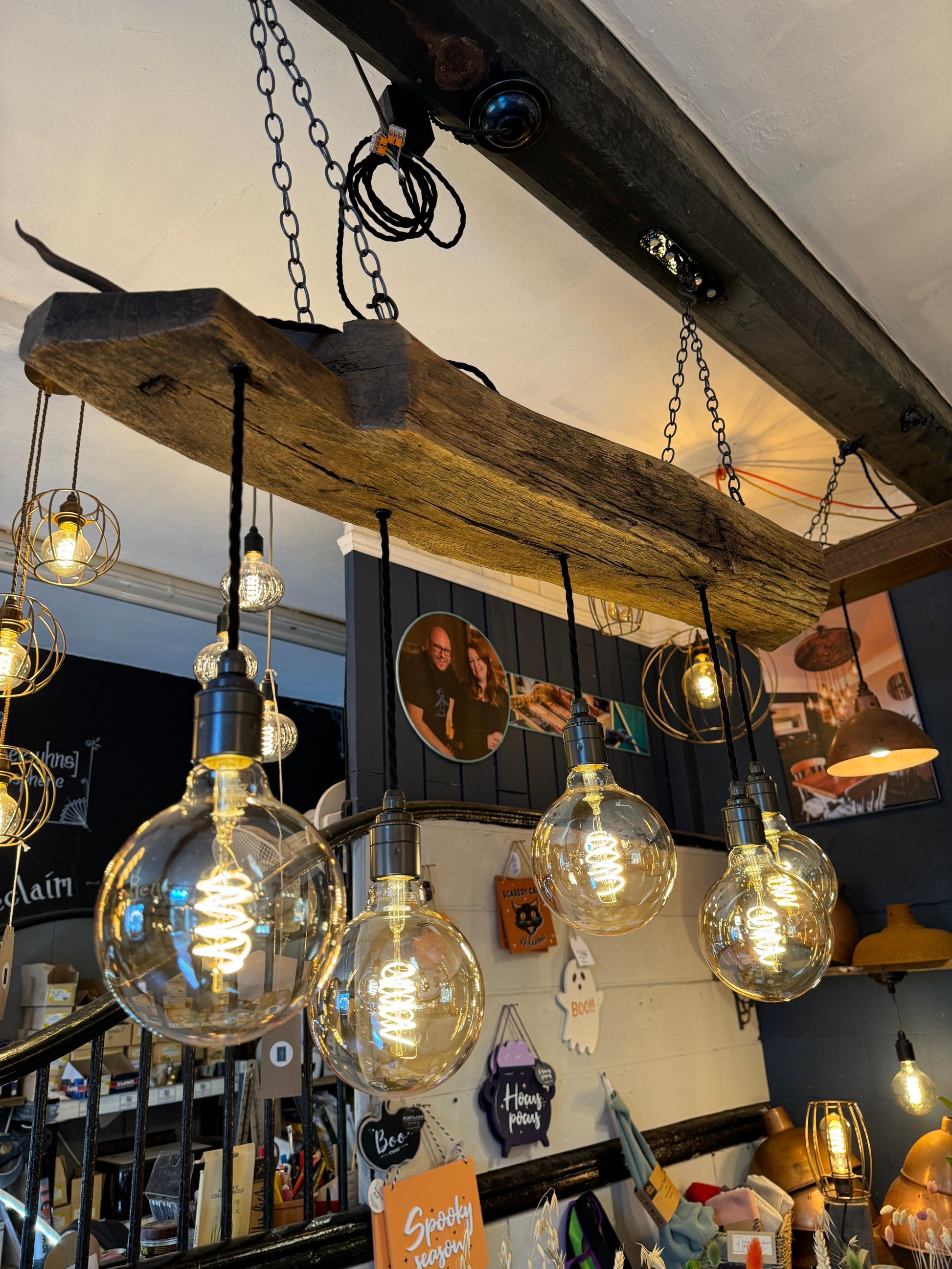 Rustic 5-light chandelier made from 300-year-old reclaimed oak beam by MooBoo Home, ideal for vintage farmhouse lighting.