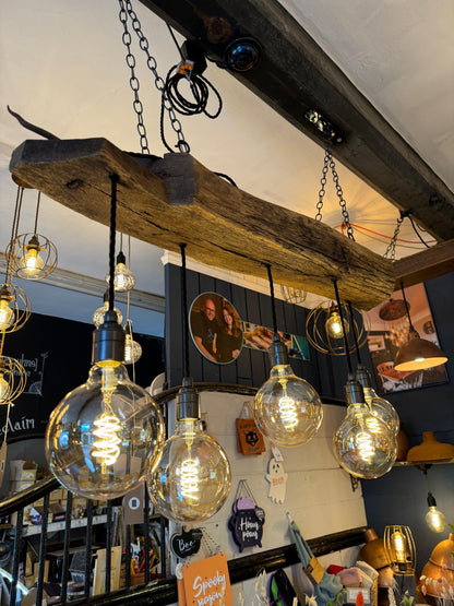 Rustic 5-light chandelier made from 300-year-old reclaimed oak beam by MooBoo Home, ideal for vintage farmhouse lighting.