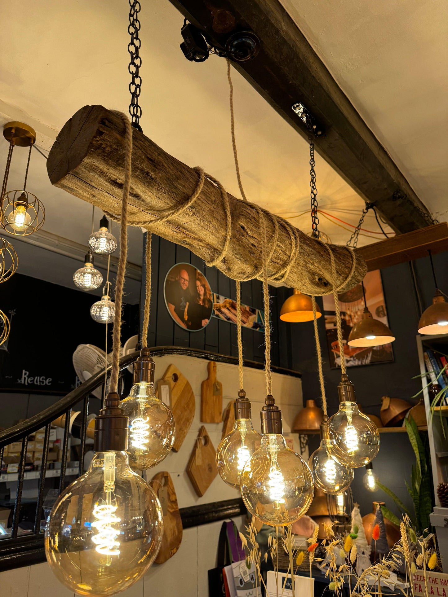 Rustic oak wrap-around chandelier by MooBoo Home featuring warm wood tones and elegant design for a cozy, stylish lighting fixture.