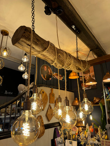Rustic oak wrap-around chandelier by MooBoo Home featuring warm wood tones and elegant design for a cozy, stylish lighting fixture.