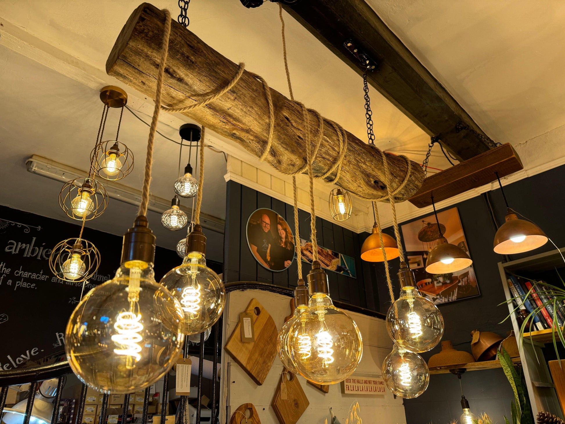 Rustic oak wrap-around chandelier by MooBoo Home featuring warm wooden detailing and elegant design for ambient lighting.