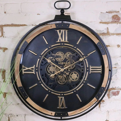 Large industrial wall clock by Maravi featuring a black and gold cog design with bold, vintage-inspired style.