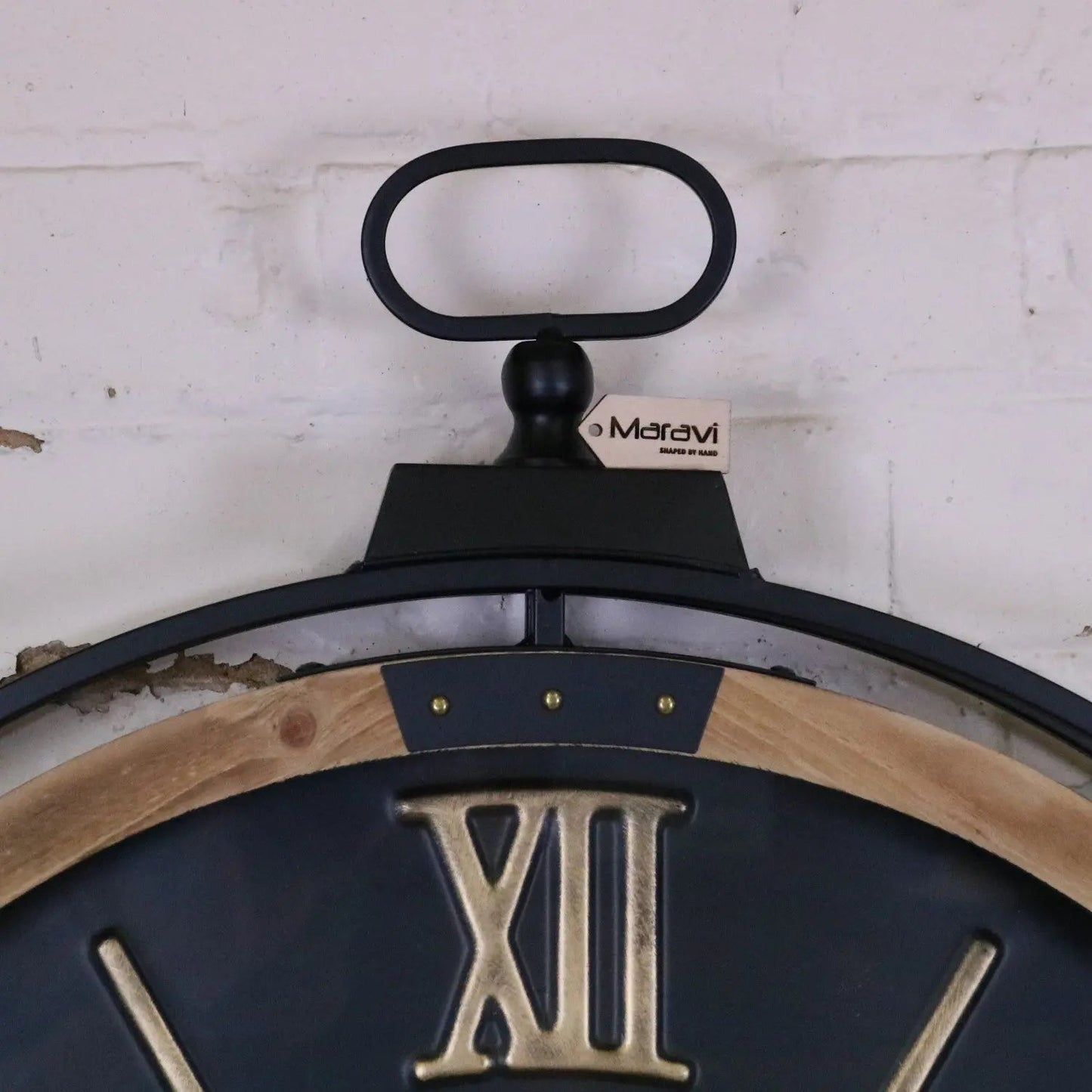 Industrial extra large black and gold cog wall clock by Maravi, featuring a vintage industrial design with bold gear details.
