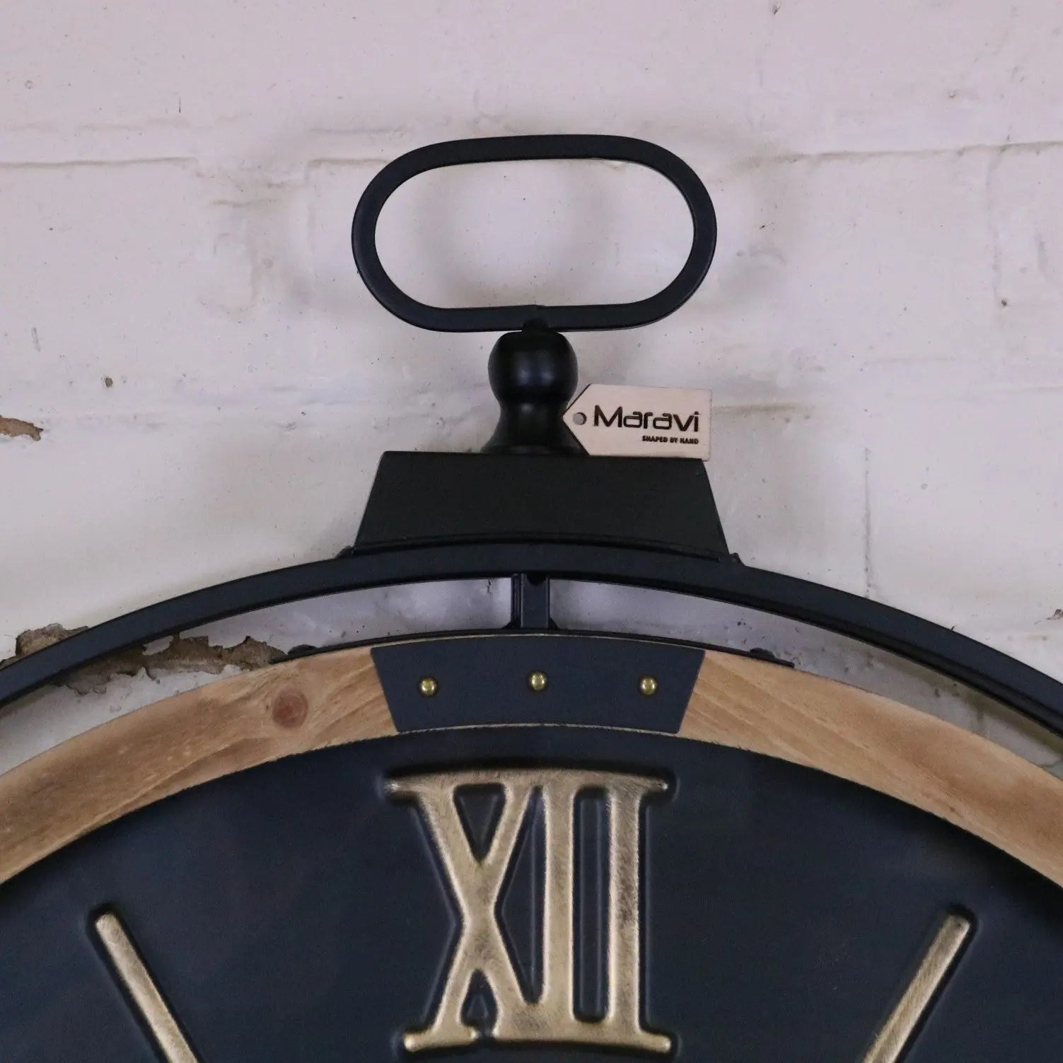 Industrial extra large black and gold cog wall clock by Maravi, featuring a vintage industrial design with bold gear details.