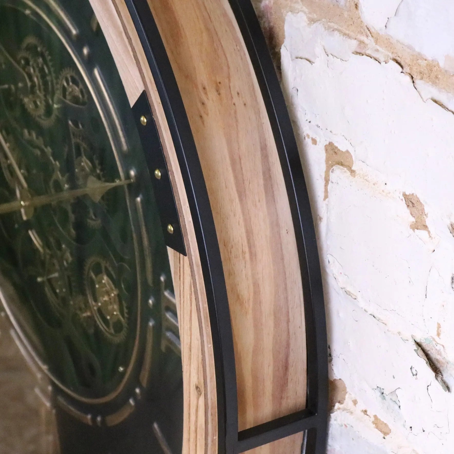 Industrial extra large black and gold cog wall clock by Maravi, featuring a vintage industrial design with bold gear details.