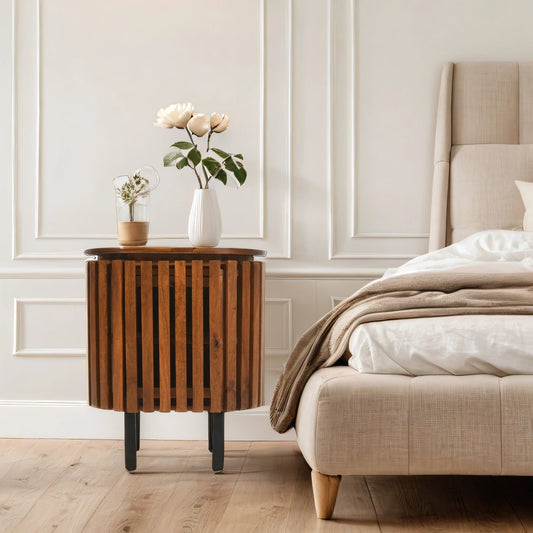 Verty Furniture Compton mango wood bedside table with sleek design, shown in a stylish bedroom setting.