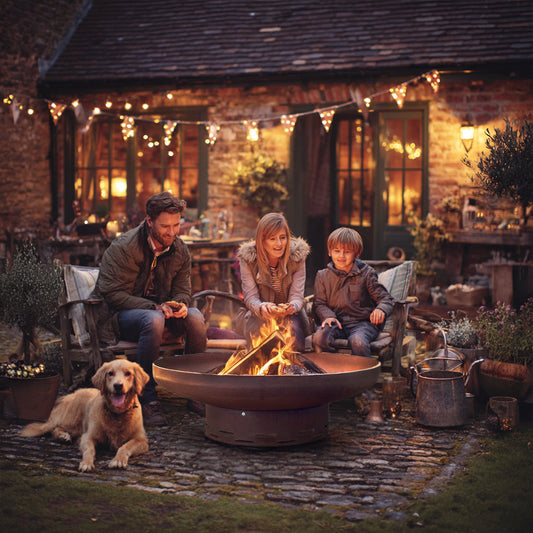 Pre-rusted corten steel round firepit by Nicoman.co.uk, heavy-duty metal fire pit with a rustic, weathered finish for outdoor use