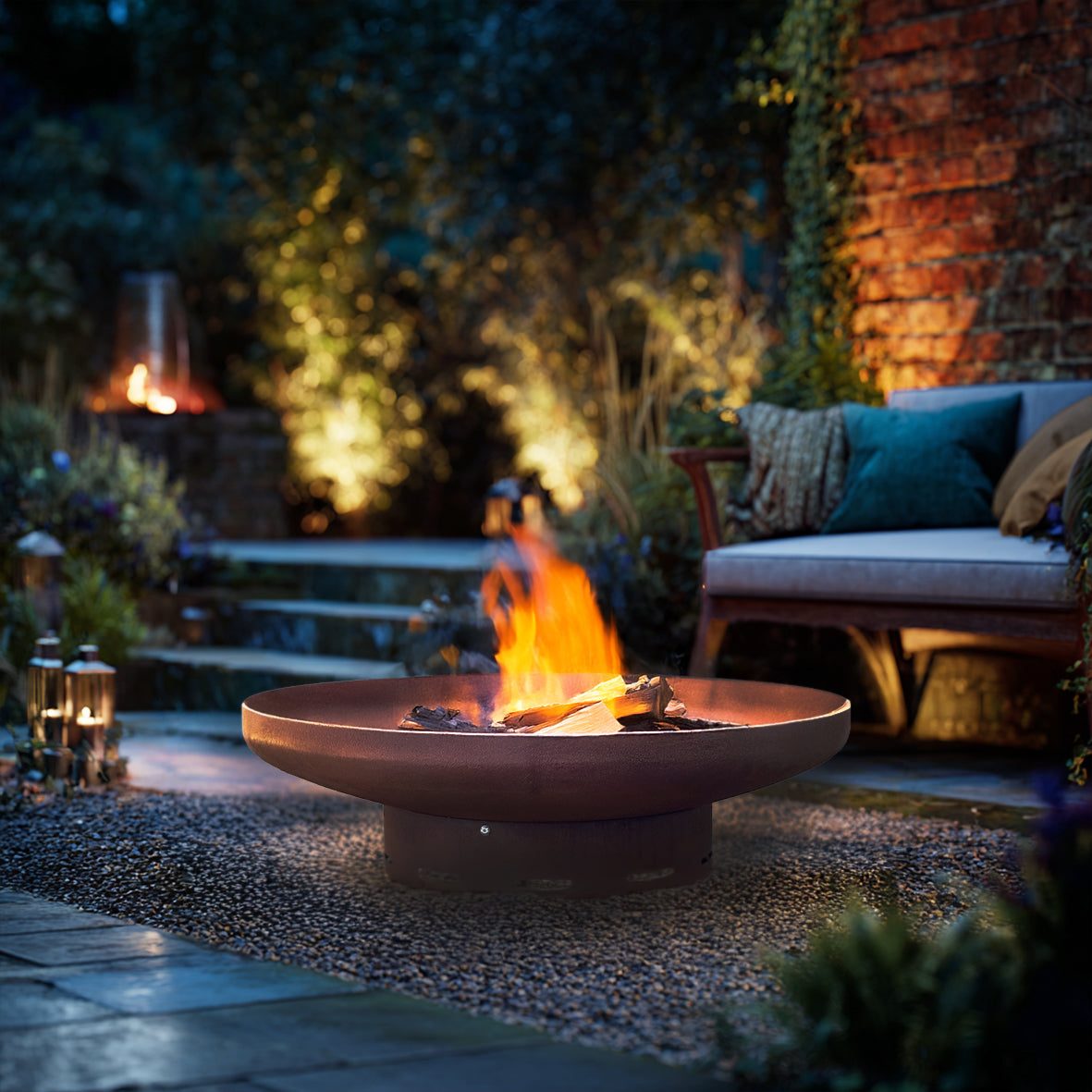 Pre-rusted corten steel round firepit by Nicoman.co.uk, heavy-duty metal fire pit with rustic finish, ideal for outdoor fireplaces.